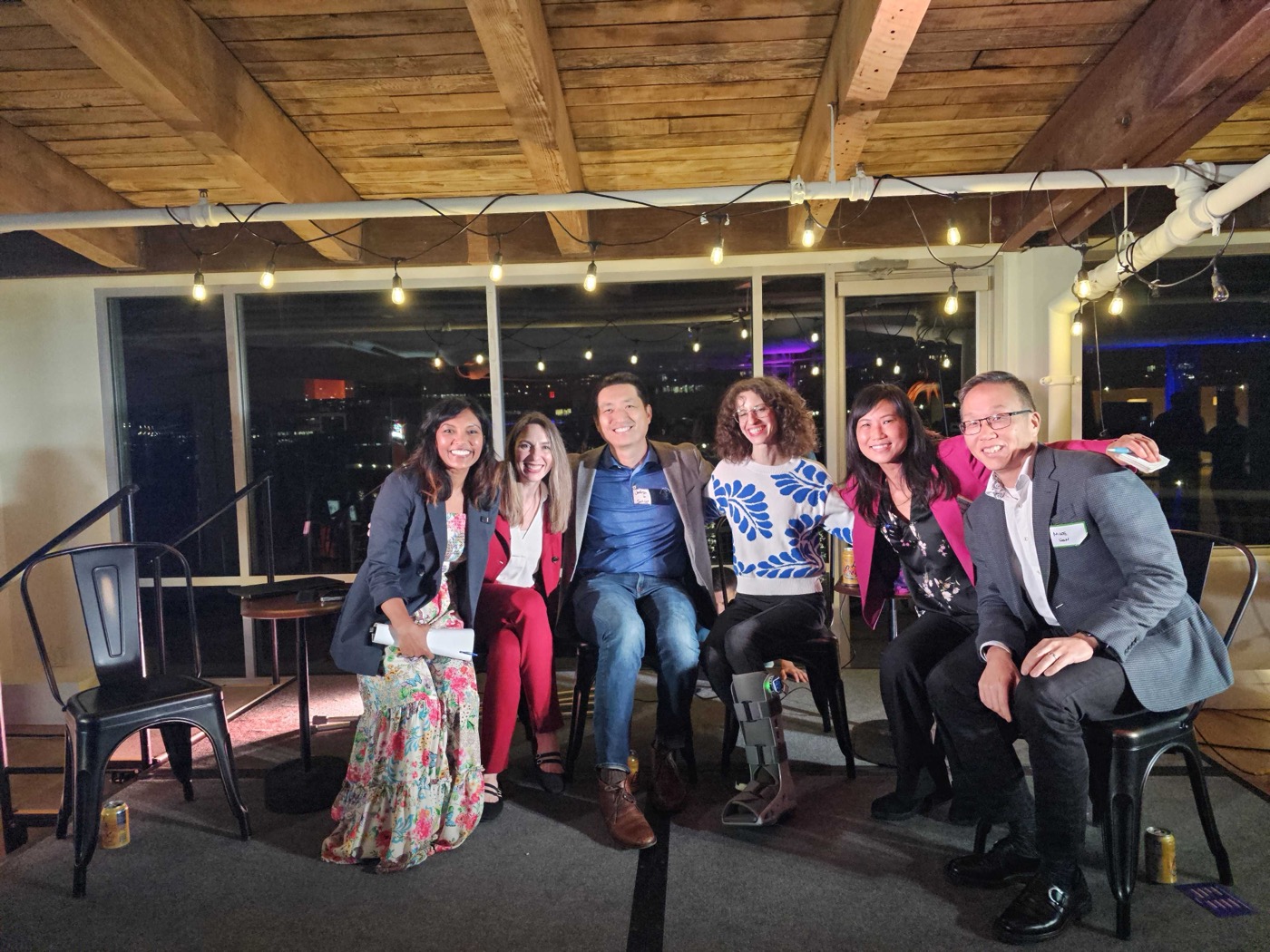 SeaHealthTech panelists together after the panel discussion at the AI House, Seattle.